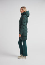Woman wearing the Diamond Belted Down Coat Matt Emerald, showcasing its stylish and functional design.