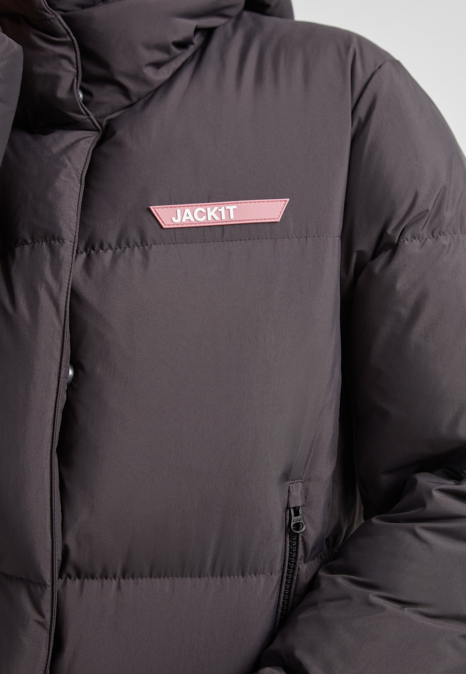 Star Shower Down Puffer Jacket Black featuring a close-up view of the jacket's structure and logo detail.