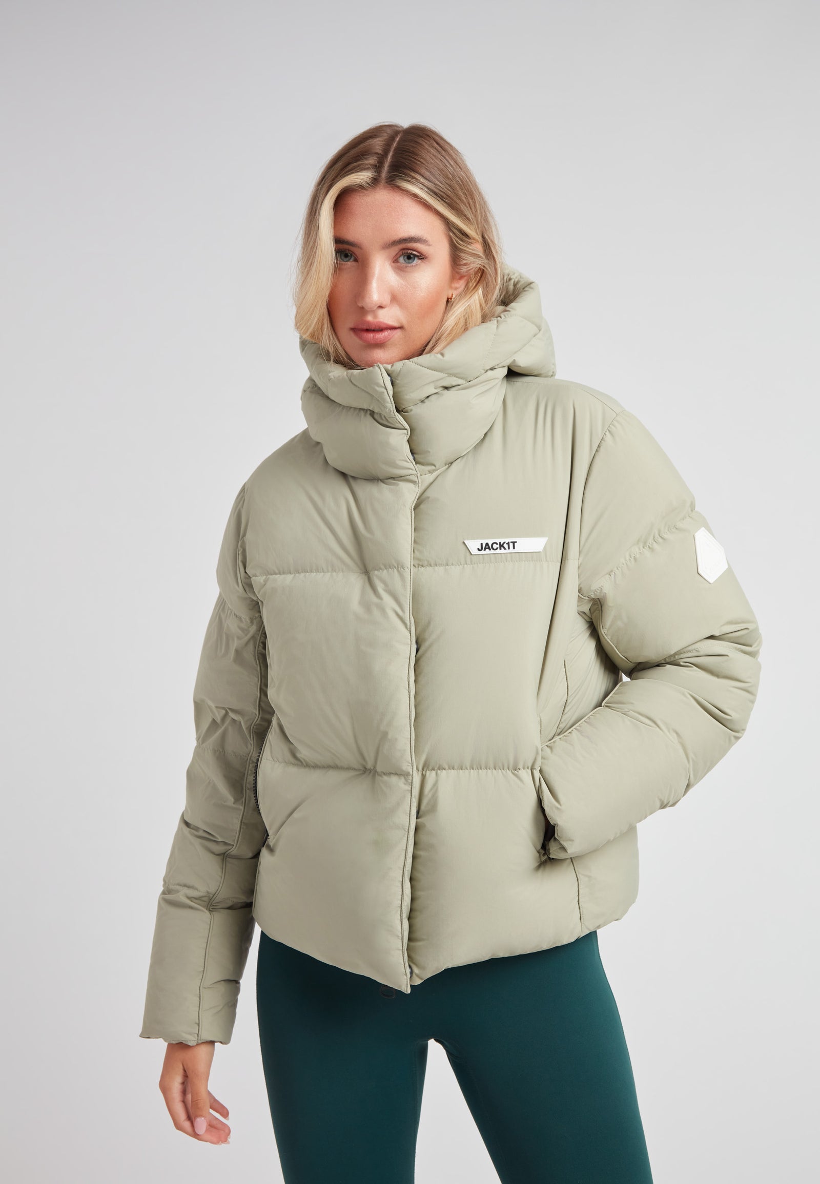 Star Shower Down Puffer Jacket Sage in soft green, featuring a cozy hood and contemporary design for winter wear.