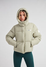 Star Shower Down Puffer Jacket Sage in soft green color, perfect for cold-season fashion and outdoor activities.