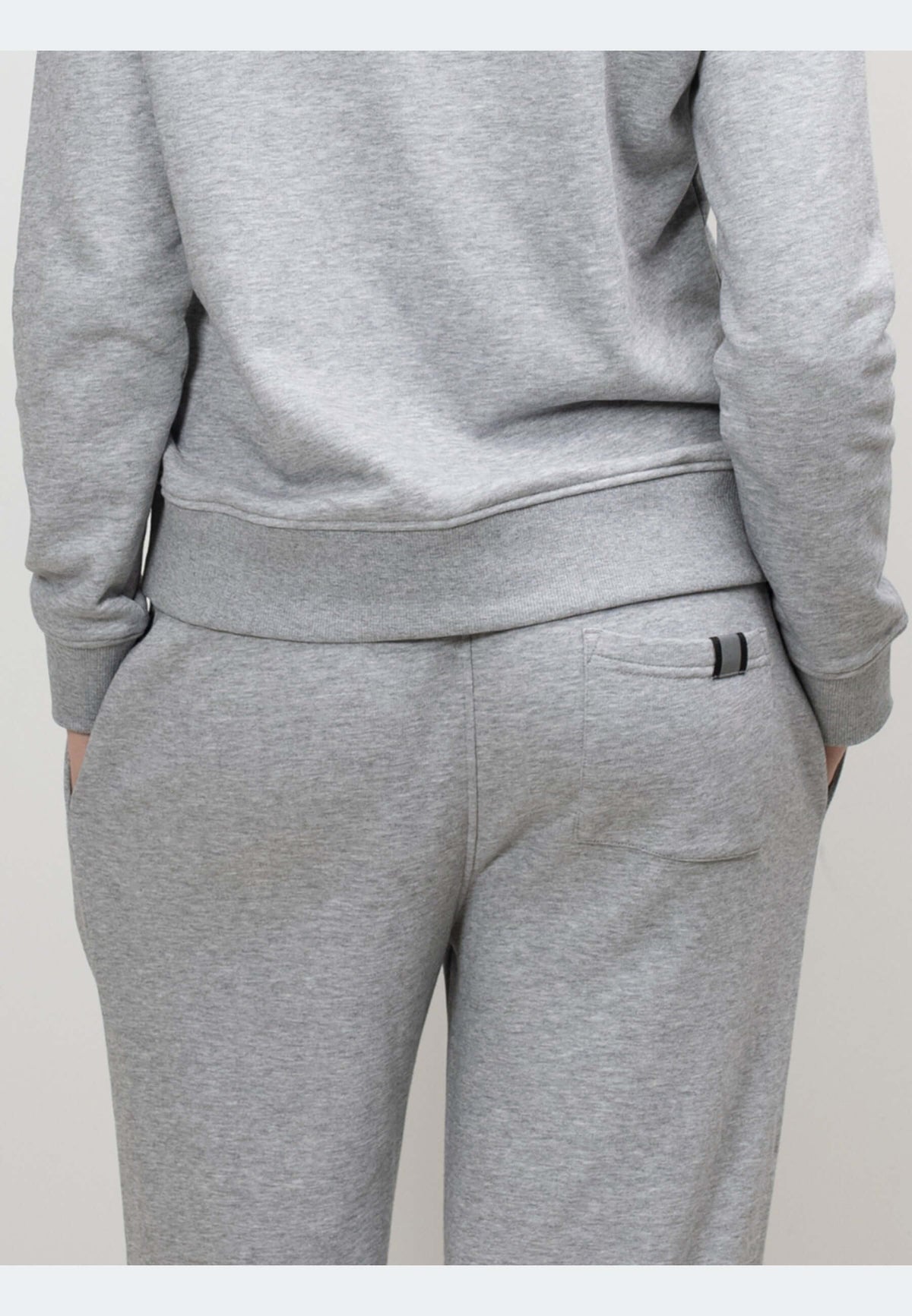 Back view of grey joggers showing relaxed fit and elastic waistband, perfect for everyday comfort.
