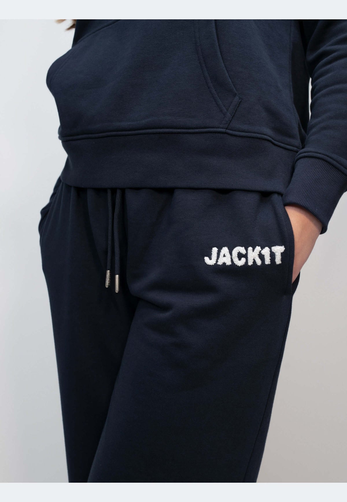 Navy joggers featuring a relaxed fit, elasticated waistband, and embroidered 'JACK1T' logo.