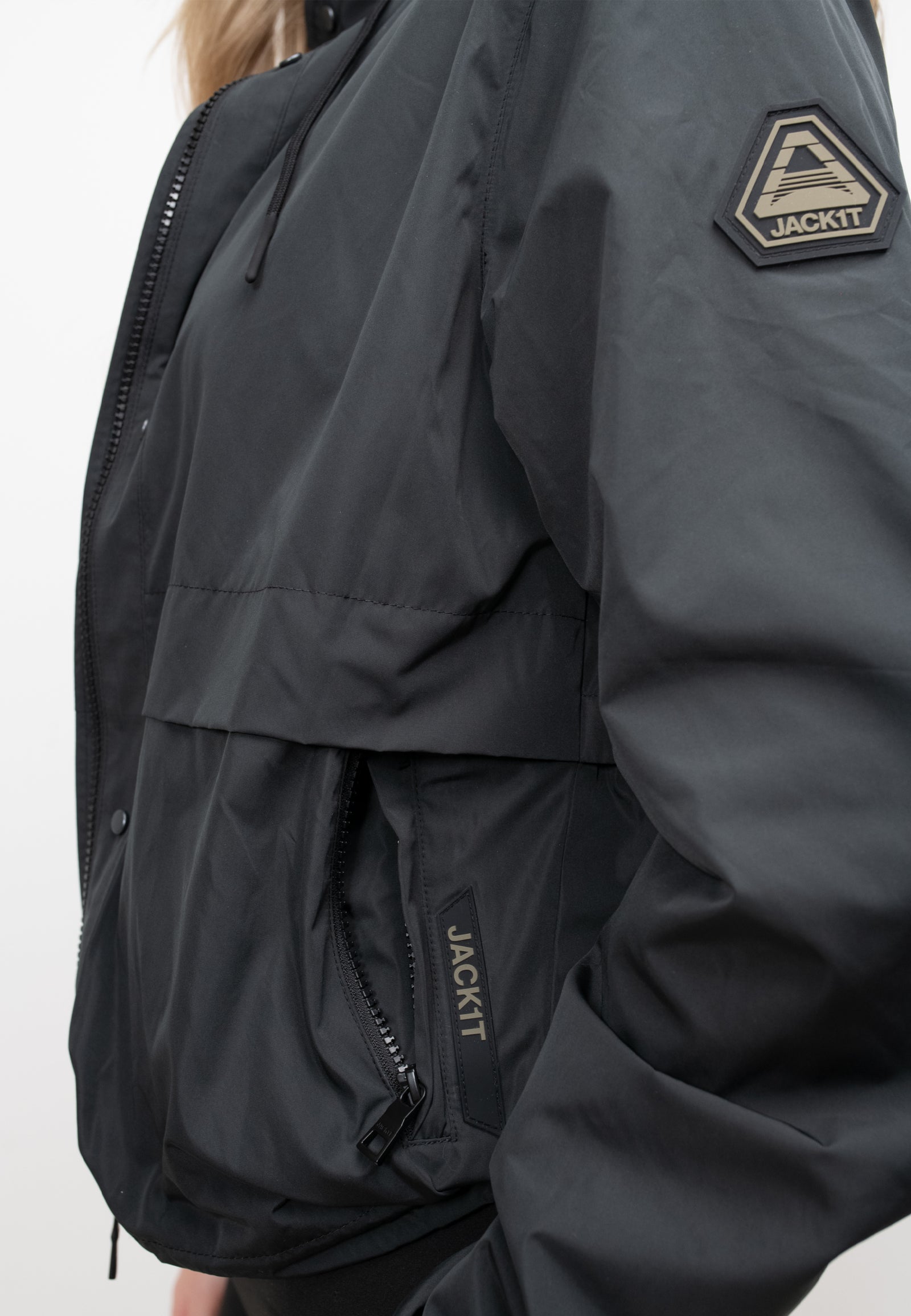 Women's Black Windbreaker featuring a water-resistant design and stylish logo detail for spring and summer wear.