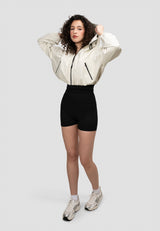 Model wearing a Women's Cream Cropped Jacket in a relaxed fit, showcasing a modern spring look.