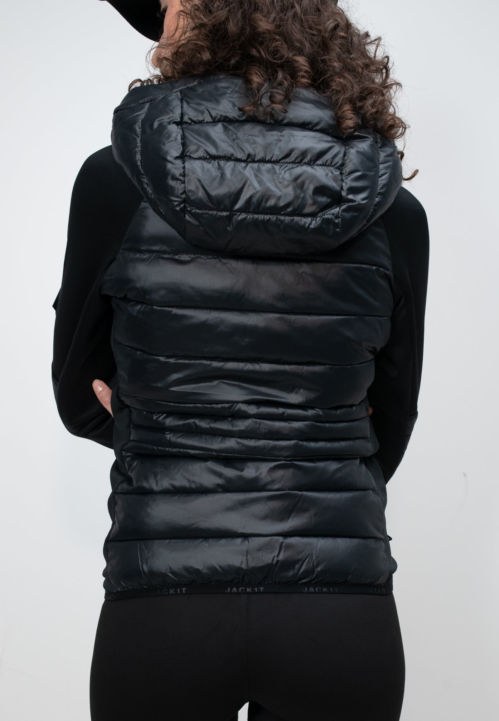 Women's black hooded jacket with a slim fit and lightweight design, perfect for spring and autumn wear.