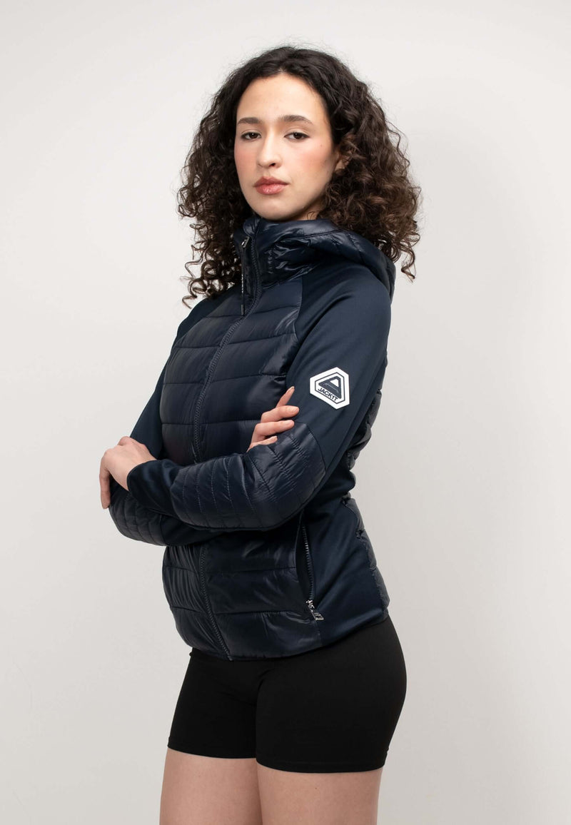 Model wearing a women's navy hooded jacket with a slim fit, showcasing its lightweight, water-resistant fabric.