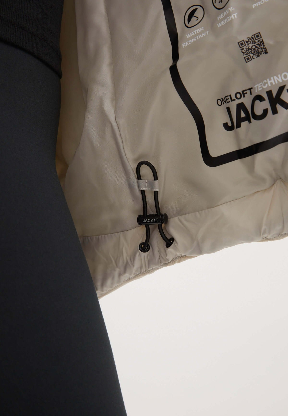 Close-up of Cloud Prime Jacket Stone interior showing ONELOFT insulation and adjustable features of the puffer jacket stone.