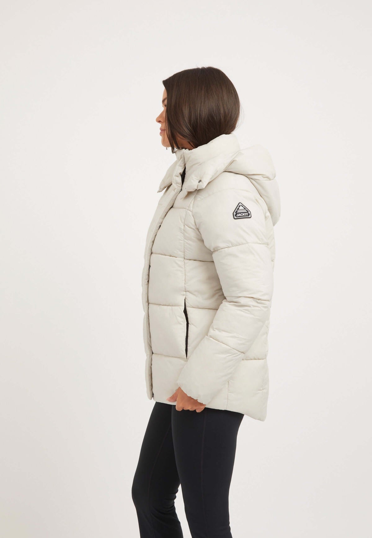 Model wearing Cloud Prime Jacket Stone, a lightweight puffer jacket stone with adjustable hood and premium insulation.