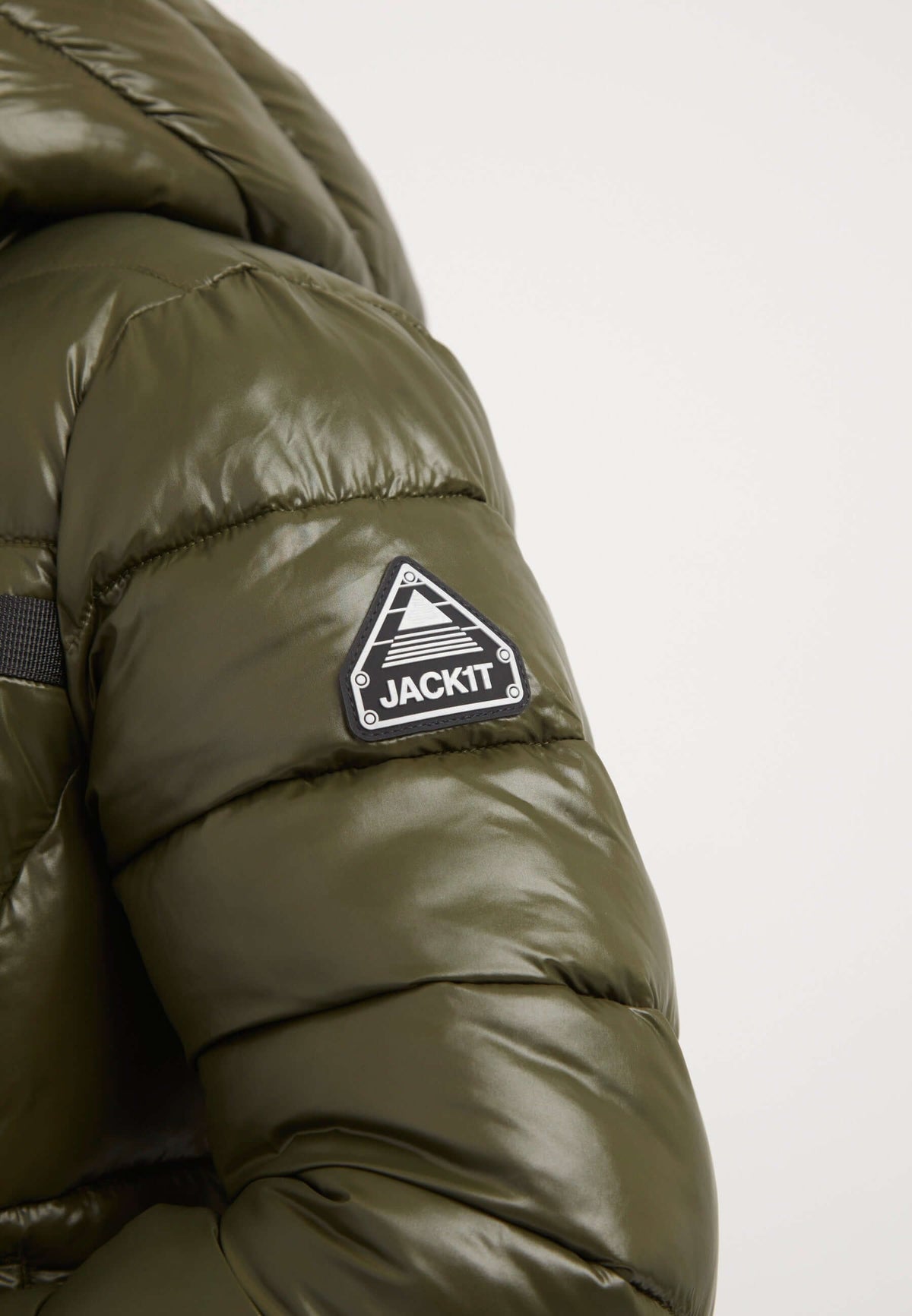 R3D Slick Racer Jacket in olive with reflective badge detail on sleeve, showcasing a fitted puffer jacket design.