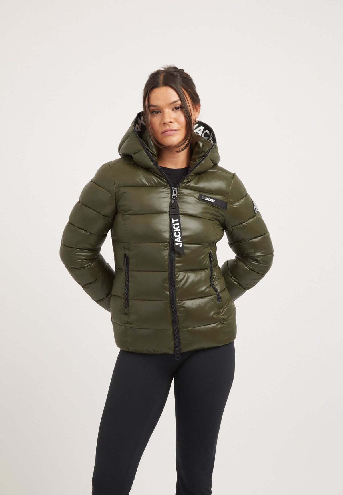 Model wearing R3D Slick Racer Jacket Olive, a fitted puffer jacket with premium insulation and elasticated cuffs.