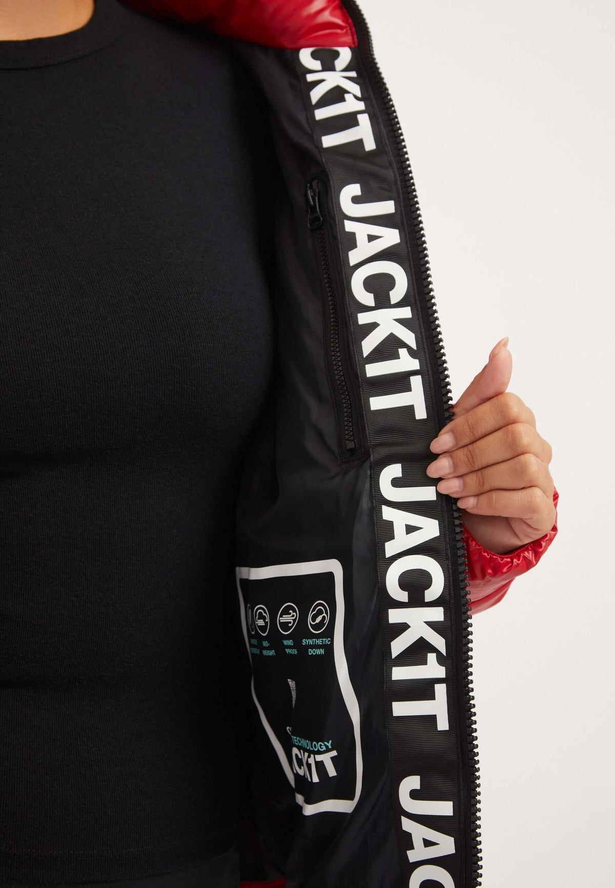 Interior view of R3D Slick Racer Jacket Cherry Red showcasing lining and internal zip pocket, highlighting short red jacket features.