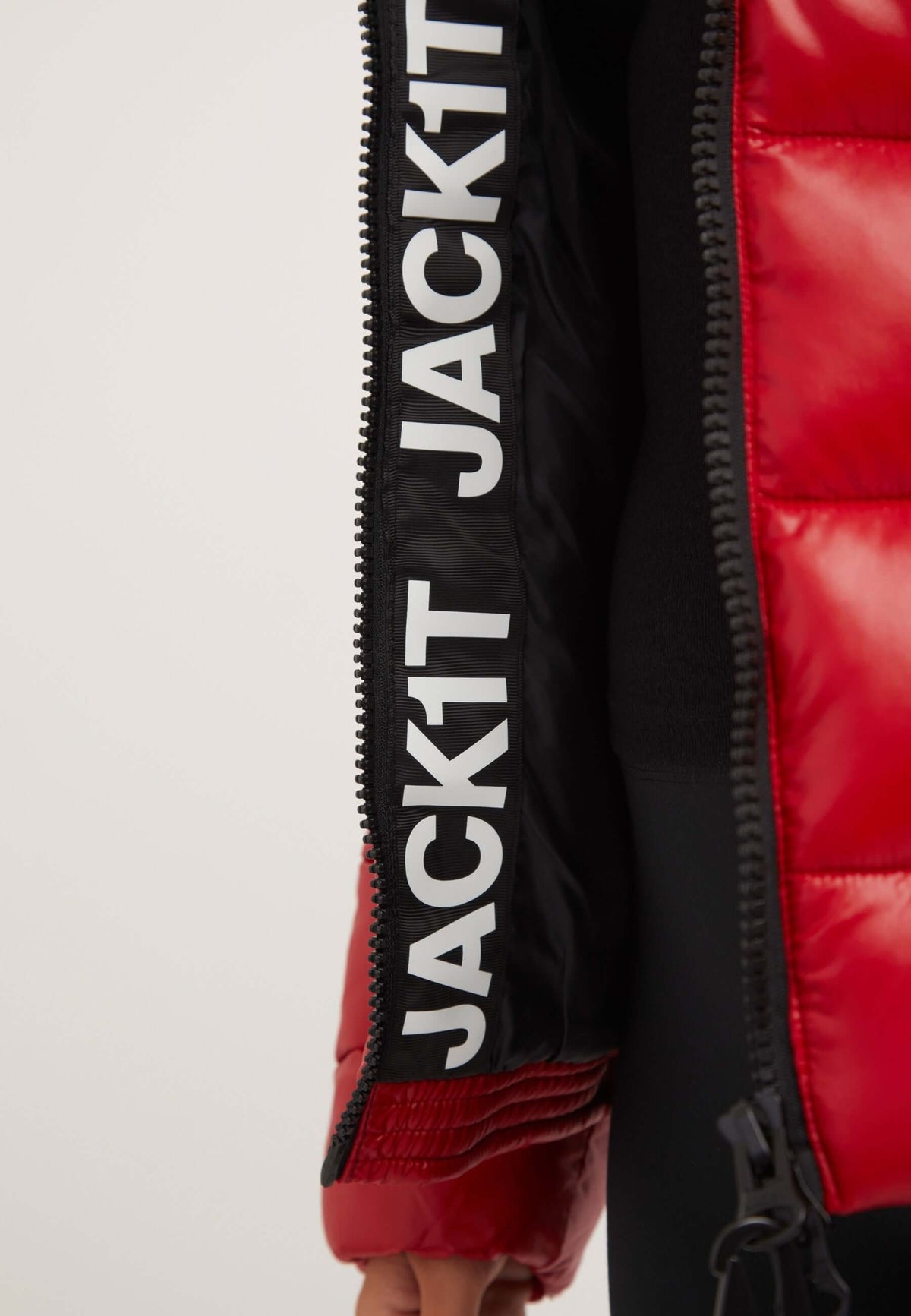 Close-up of R3D Slick Racer Jacket Cherry Red, featuring logo and design details, ideal for a short red jacket.