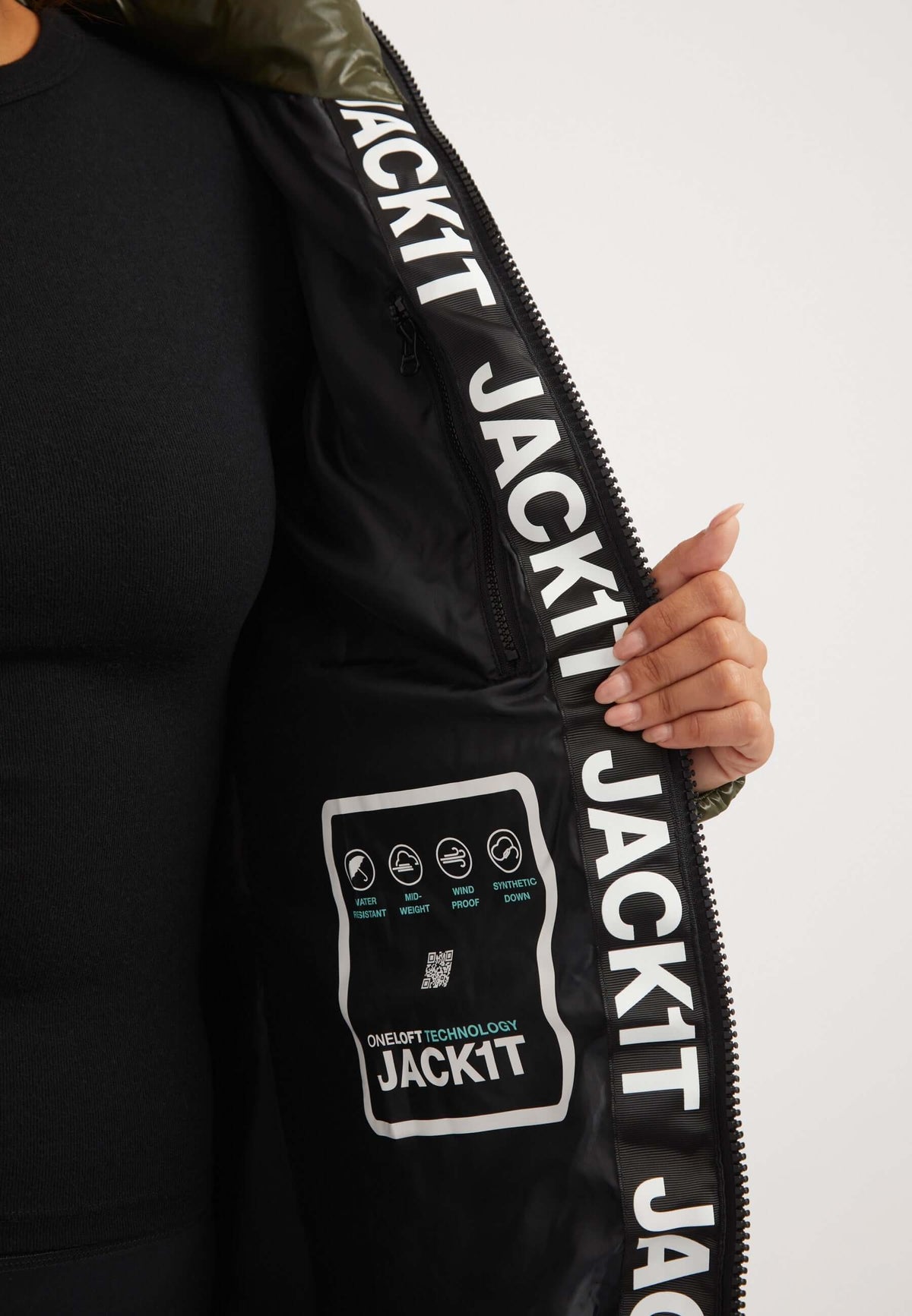 Interior view of R3D Slick Coat Olive showing ONELOFT technology and branding, emphasizing its mid length olive coat design.