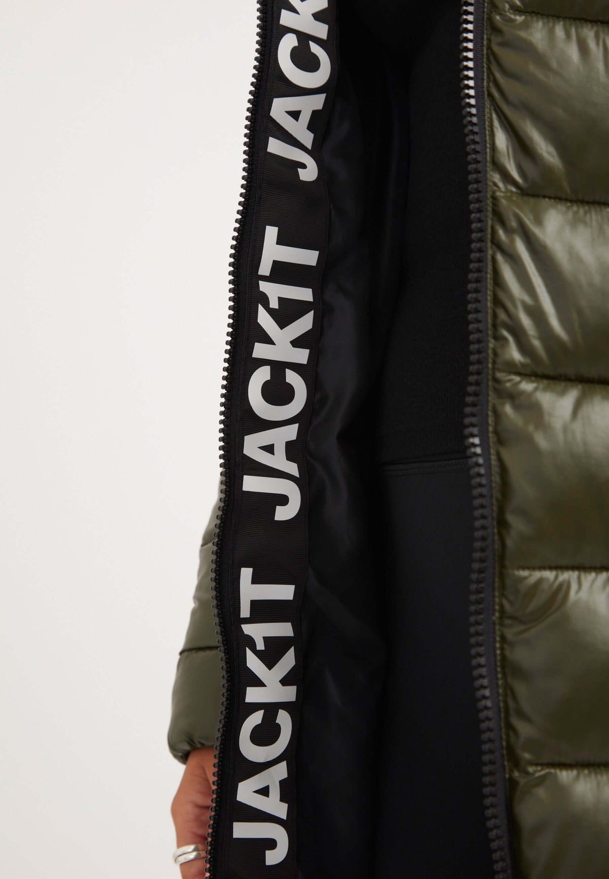 Interior view of the R3D Slick Coat Olive showcasing brand logo detail and insulation features, ideal for a mid length olive coat.