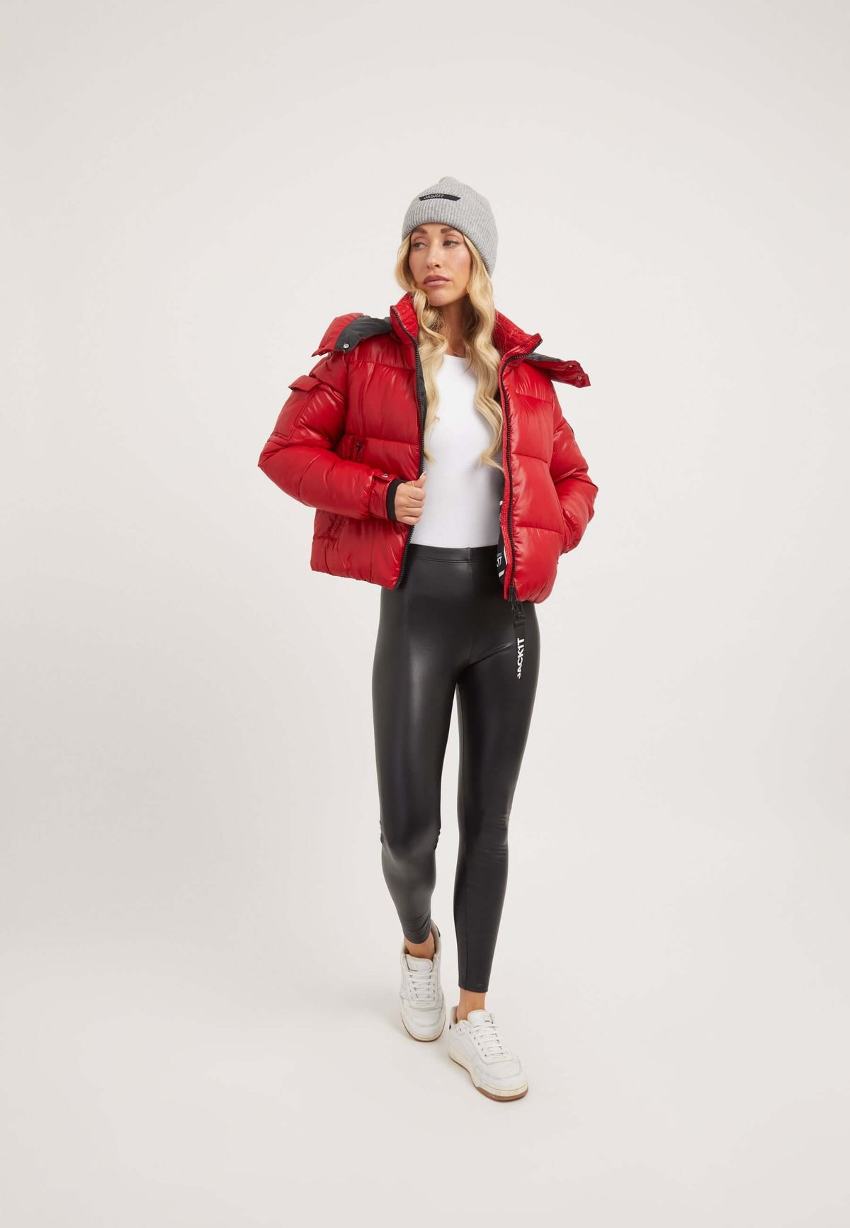 Model wearing a EZ Racer Slick Hood Jacket in cherry red, showcasing the red puffer jacket with tapered racer fit.