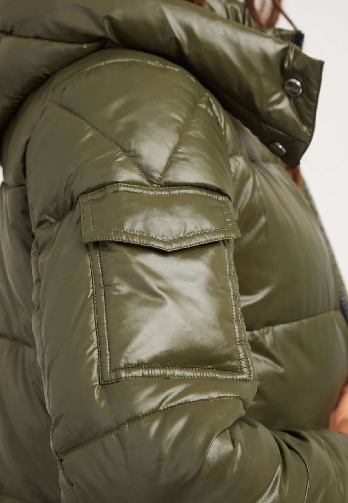 Close-up of the sleeve detail on the EZ Slick Ultra Long Coat Olive, showcasing the premium insulation and stylish design, Extra long puffer coat.