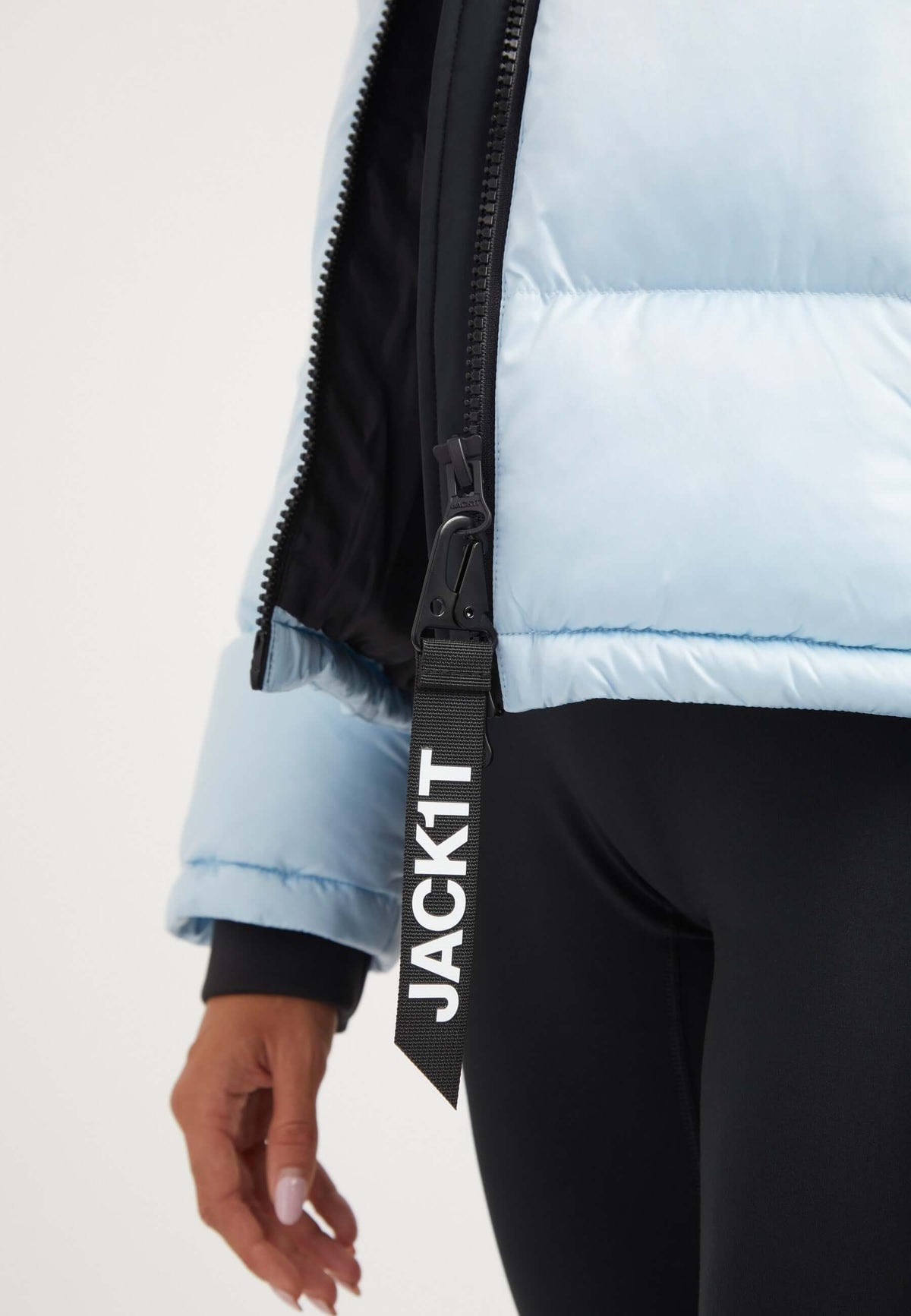 Funnel neck jacket in powder blue with contrasting color panels and zipper detail.