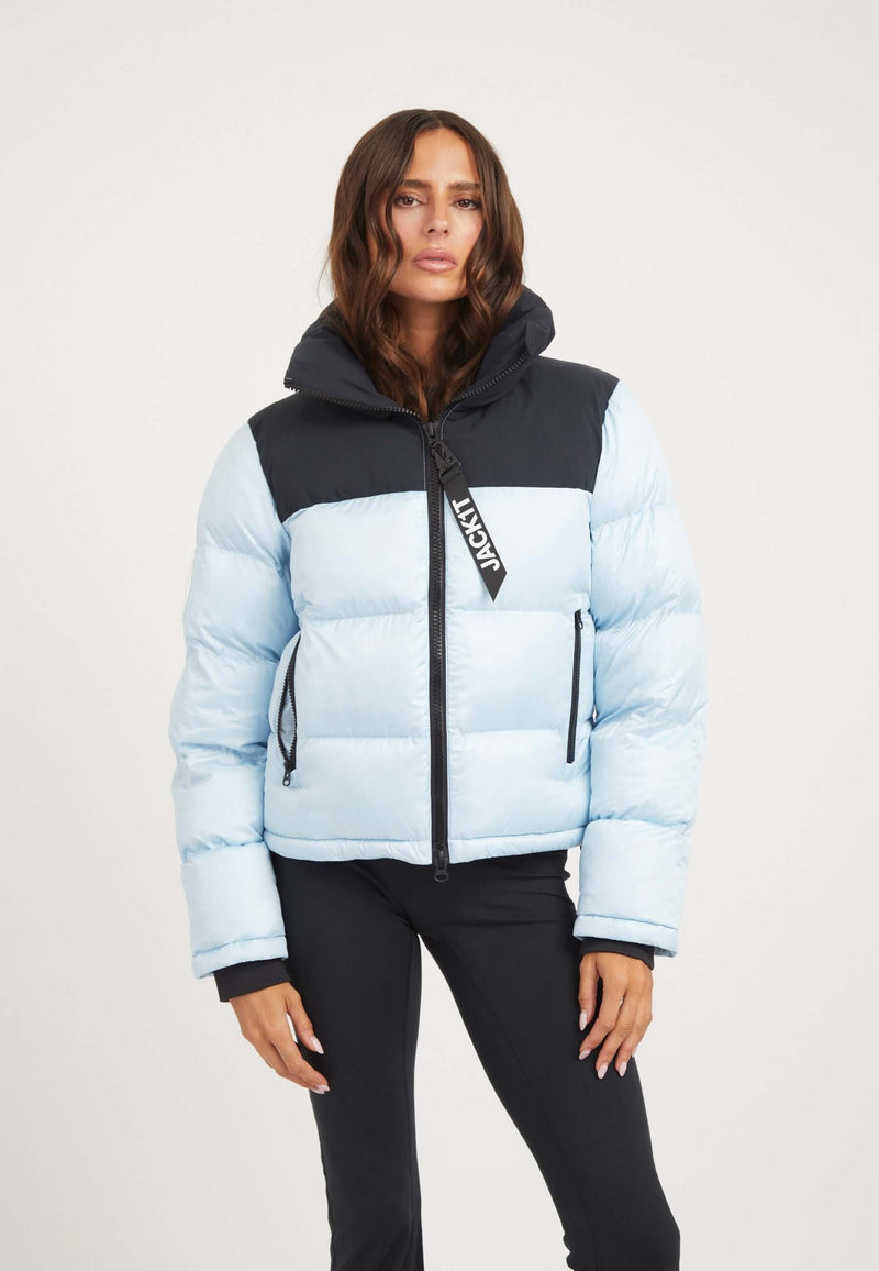 Model wearing a Powder Blue and Black Funnel neck jacket with a tapered racer fit and premium synthetic insulation.