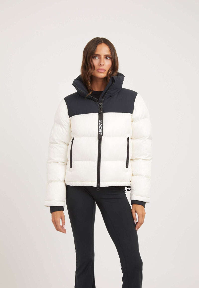 Model wearing Diamond Funnel Jacket in Snow Black, showcasing funnel neck jacket style with contrasting color panels.