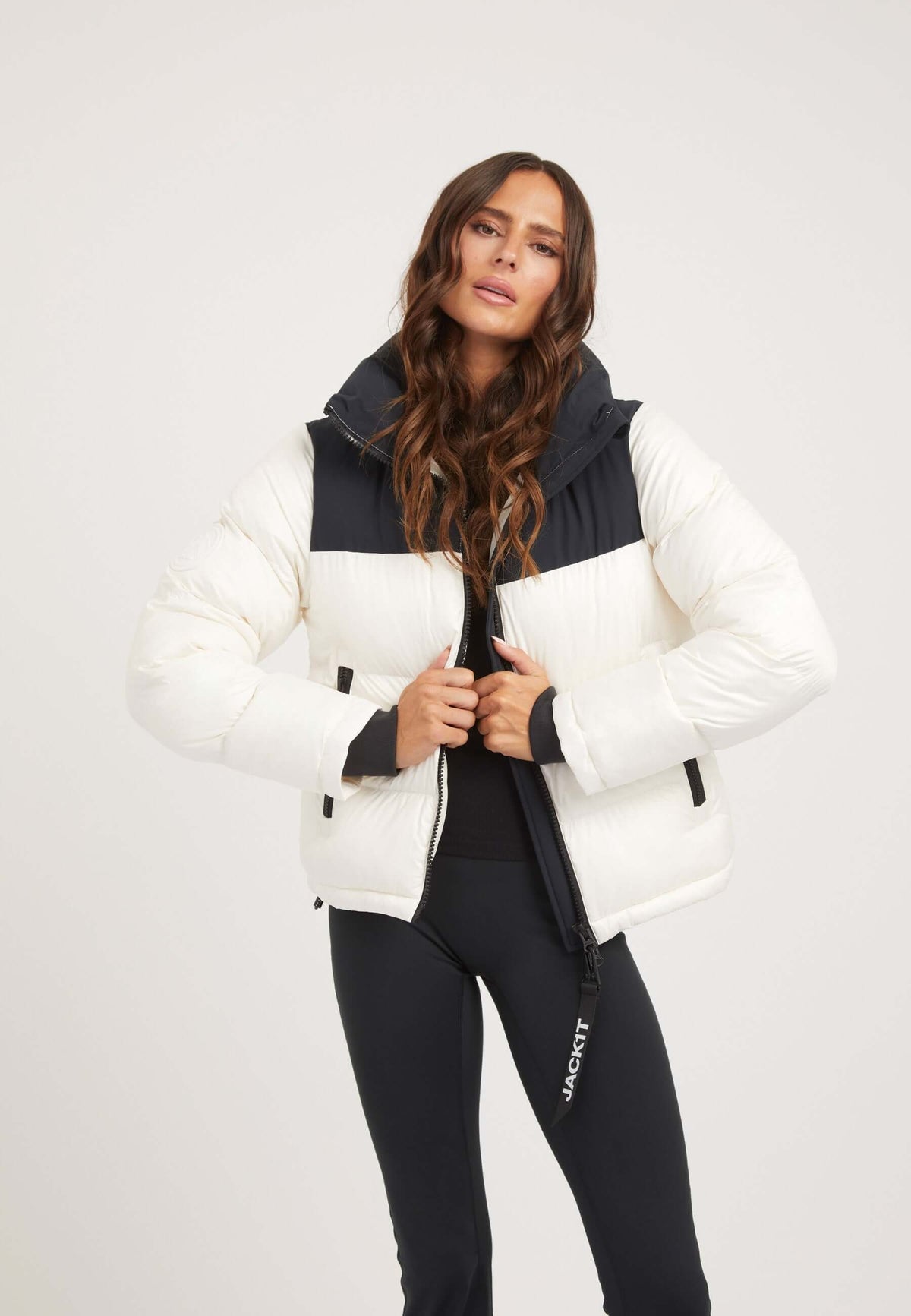 Model wearing Diamond Funnel Jacket Snow Black featuring funnel neck jacket design, contrasting color panels, and water repellent fabric.
