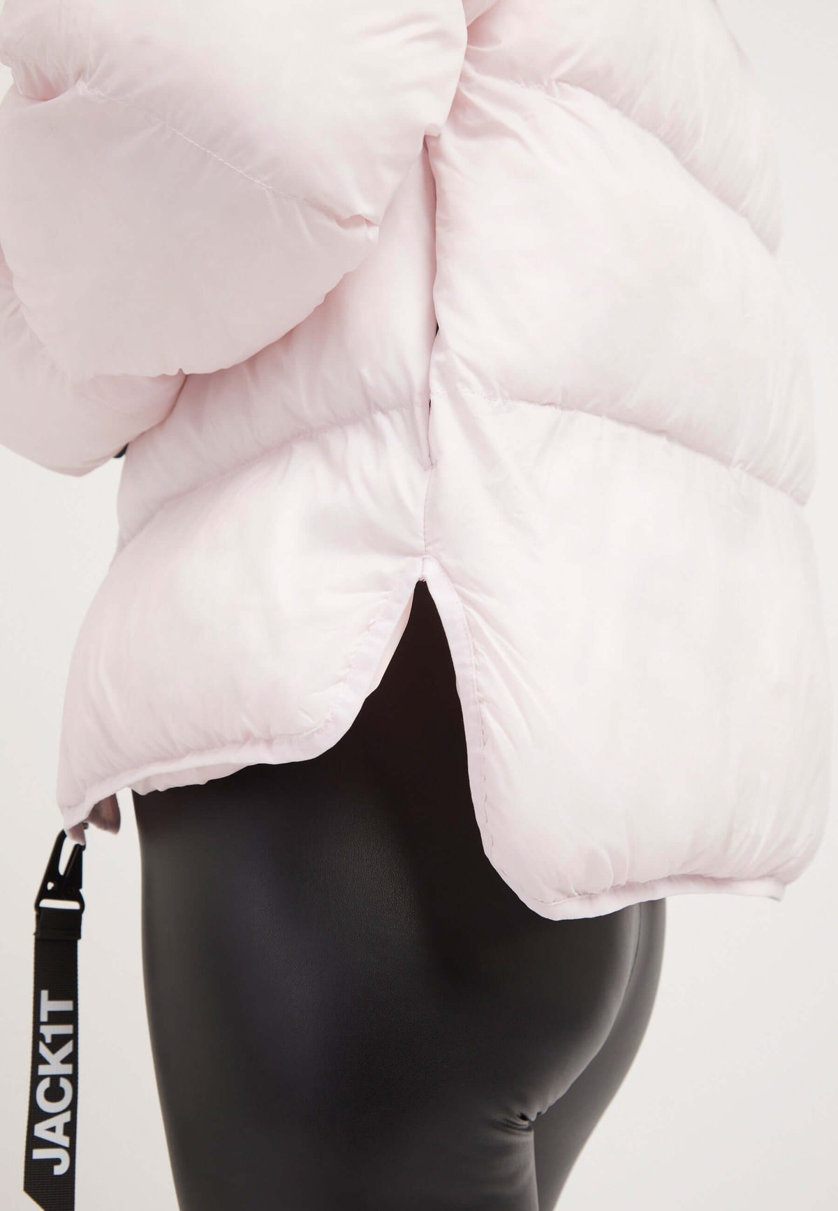 Short puffer jacket women in soft pink, featuring cropped silhouette and adjustable design details.