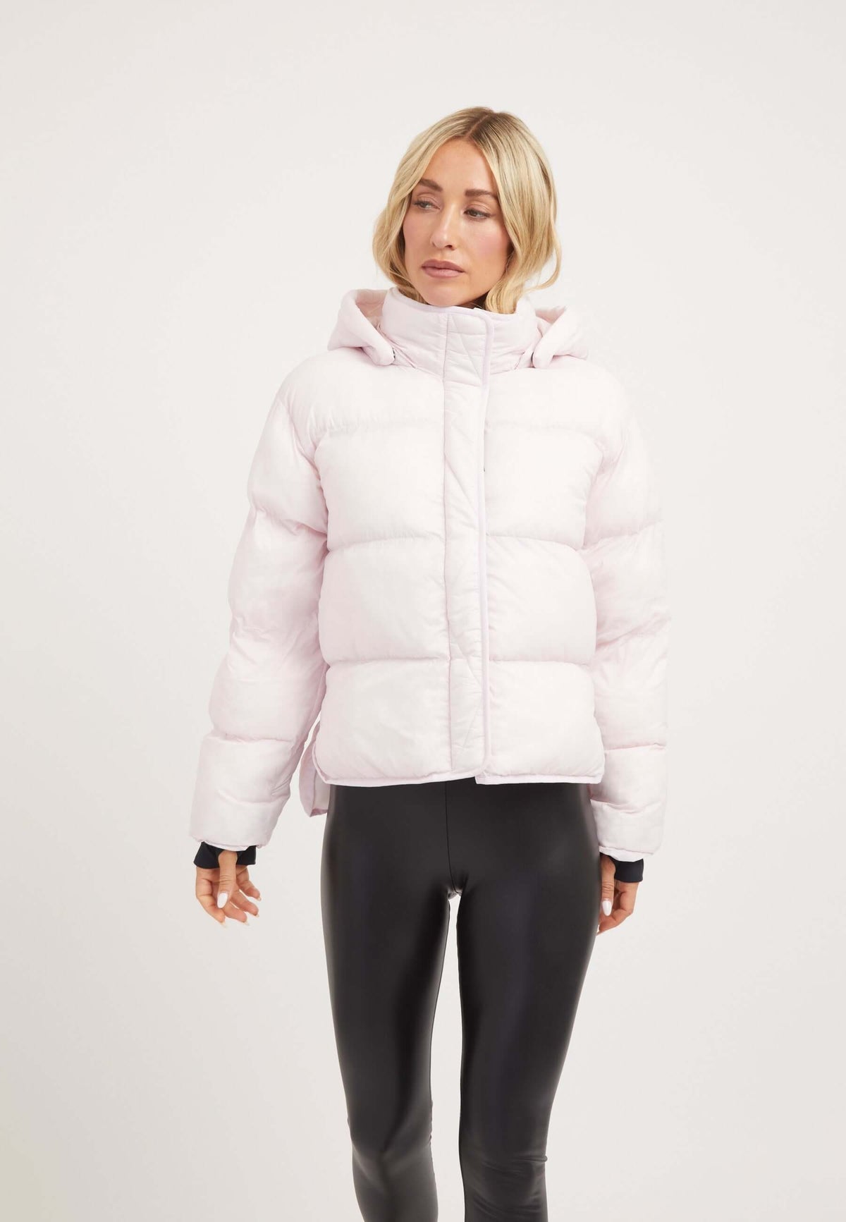 Helio Crop Duvet Jacket in Soft Pink, showcasing a cropped silhouette, adjustable hood, and lightweight construction, ideal short puffer jacket women.