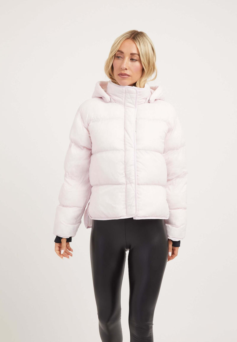 Helio Crop Duvet Jacket in Soft Pink, showcasing a cropped silhouette, adjustable hood, and lightweight construction, ideal short puffer jacket women.
