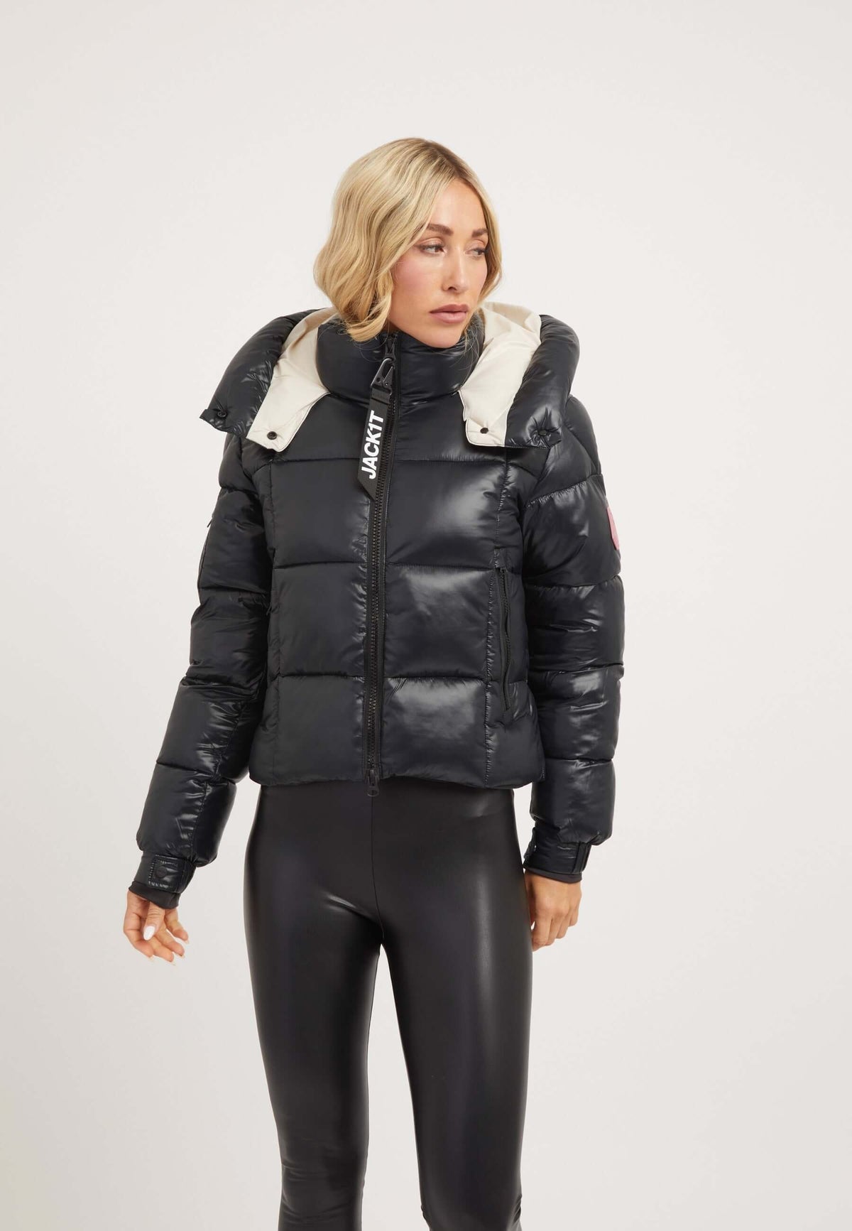 Model wearing EZ Box Crop Jacket Black, a stylish short puffer jacket women with a cropped fit and grown-on hood.