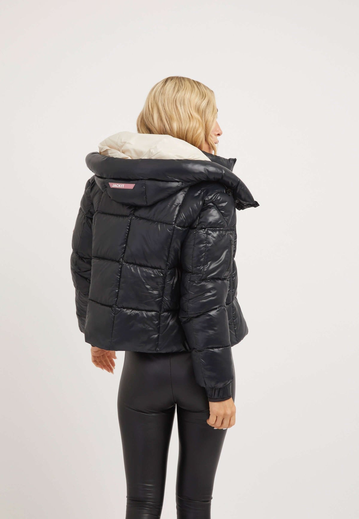 Black EZ Box Crop Jacket for women, featuring a cropped fit and grown-on hood, ideal for off-duty ski style. Short puffer jacket women.