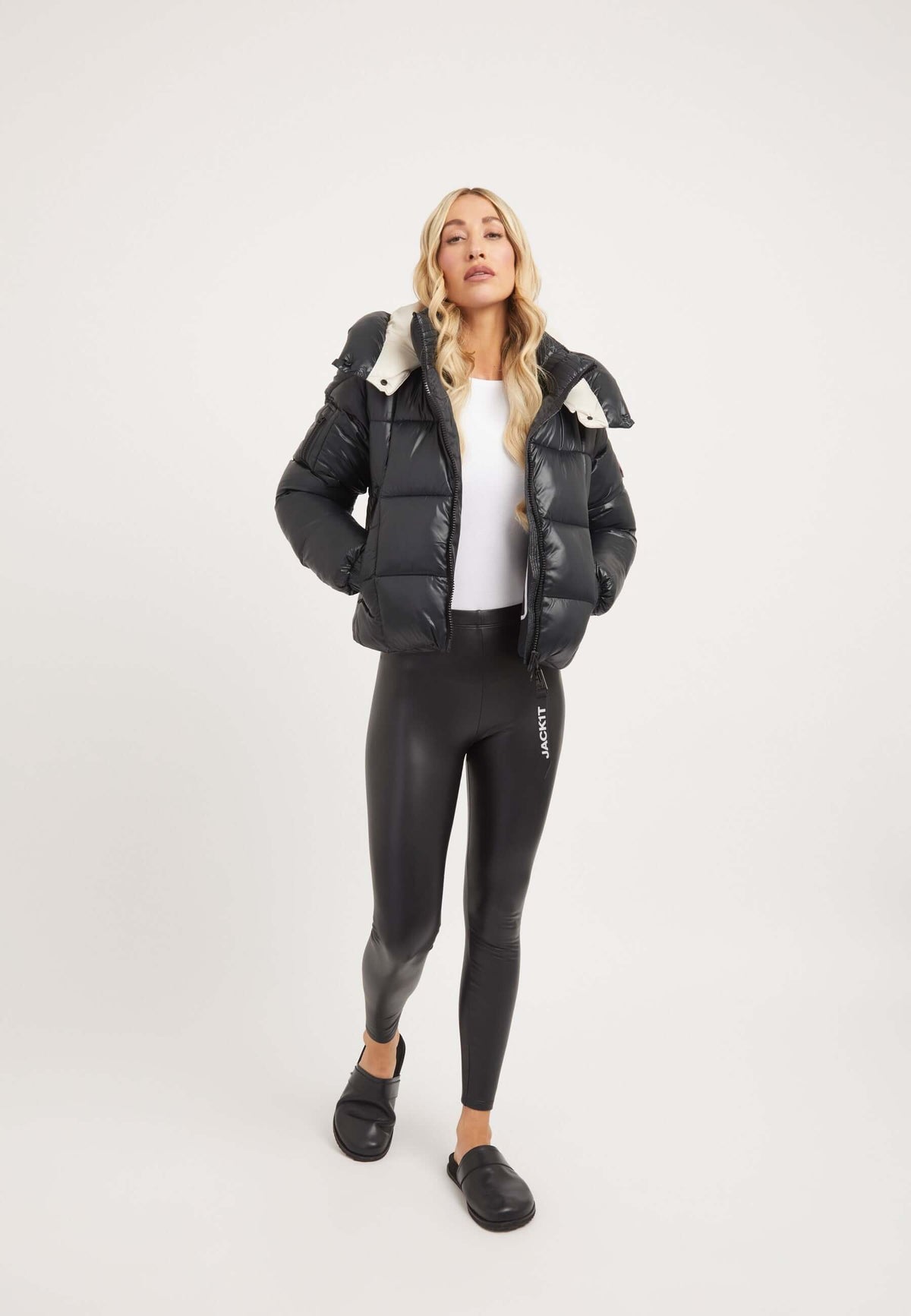 Model wearing EZ Box Crop Jacket Black, a short puffer jacket women with cropped fit and grown-on hood.