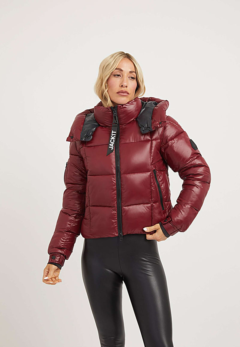 Model wearing a cropped EZ Box Crop Jacket in Dark Cranberry, showcasing the short puffer jacket women style.