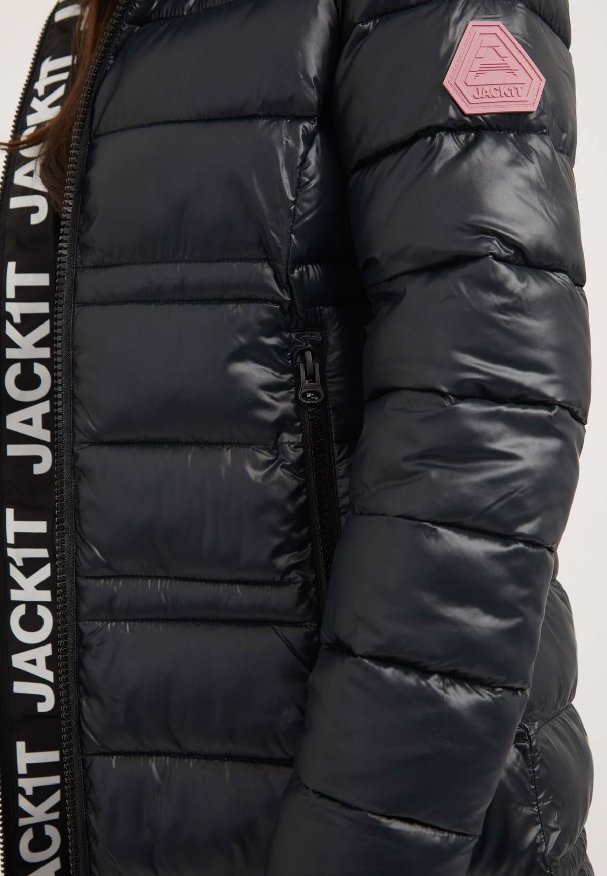 R4D Extra Long Puffer Coat in black showing the side view with reflective badge and elasticated cuffs.