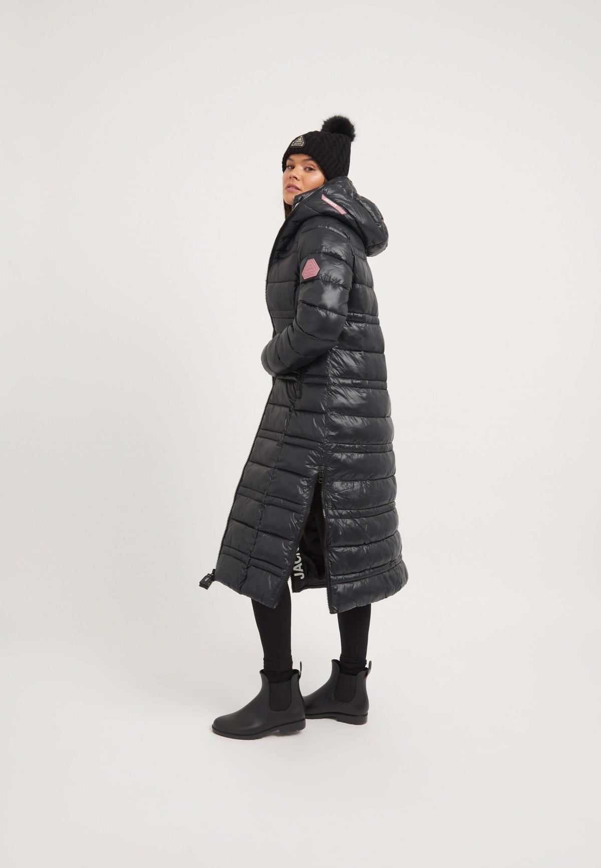 Model wearing R4D Extra Long Puffer Coat in black, showcasing full length and stylish design.