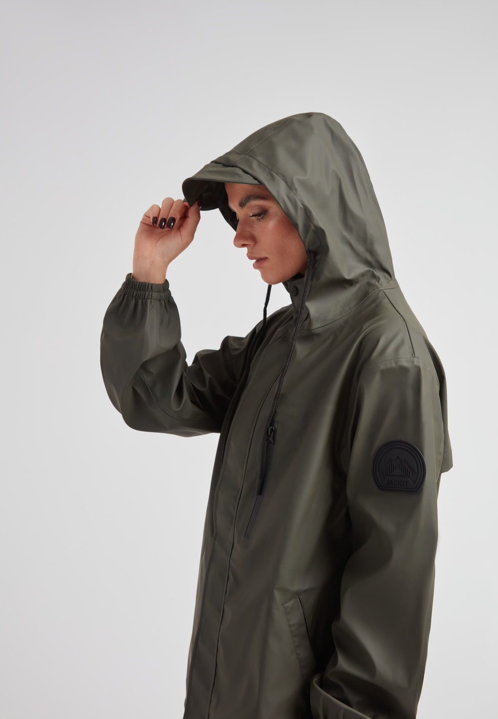 Model wearing ELEMENTS Raincoat 2.0 Khaki, showcasing its lightweight and stylish design.