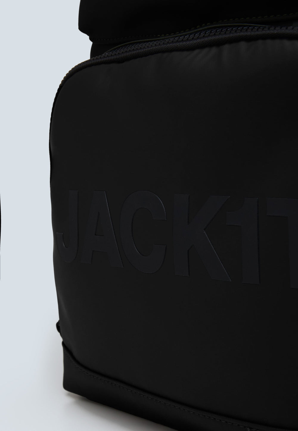 JACK1T's black water resistant backpack close-up showing the logo and sleek design.