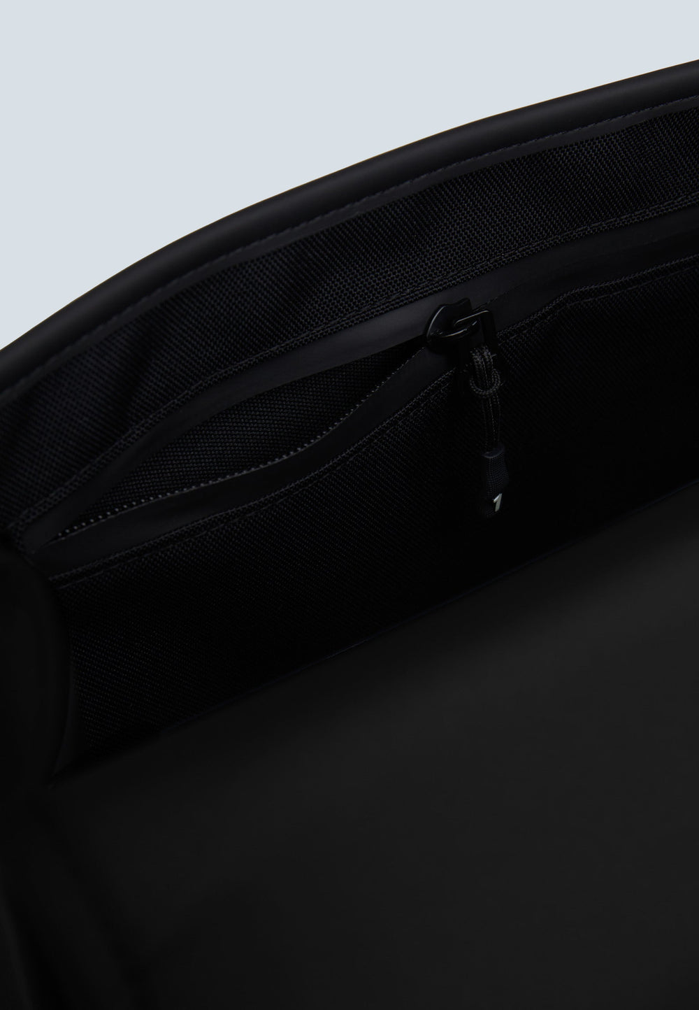 Interior pocket view of The JACK1T slim messenger laptop bag in black, highlighting its practical design and organization.