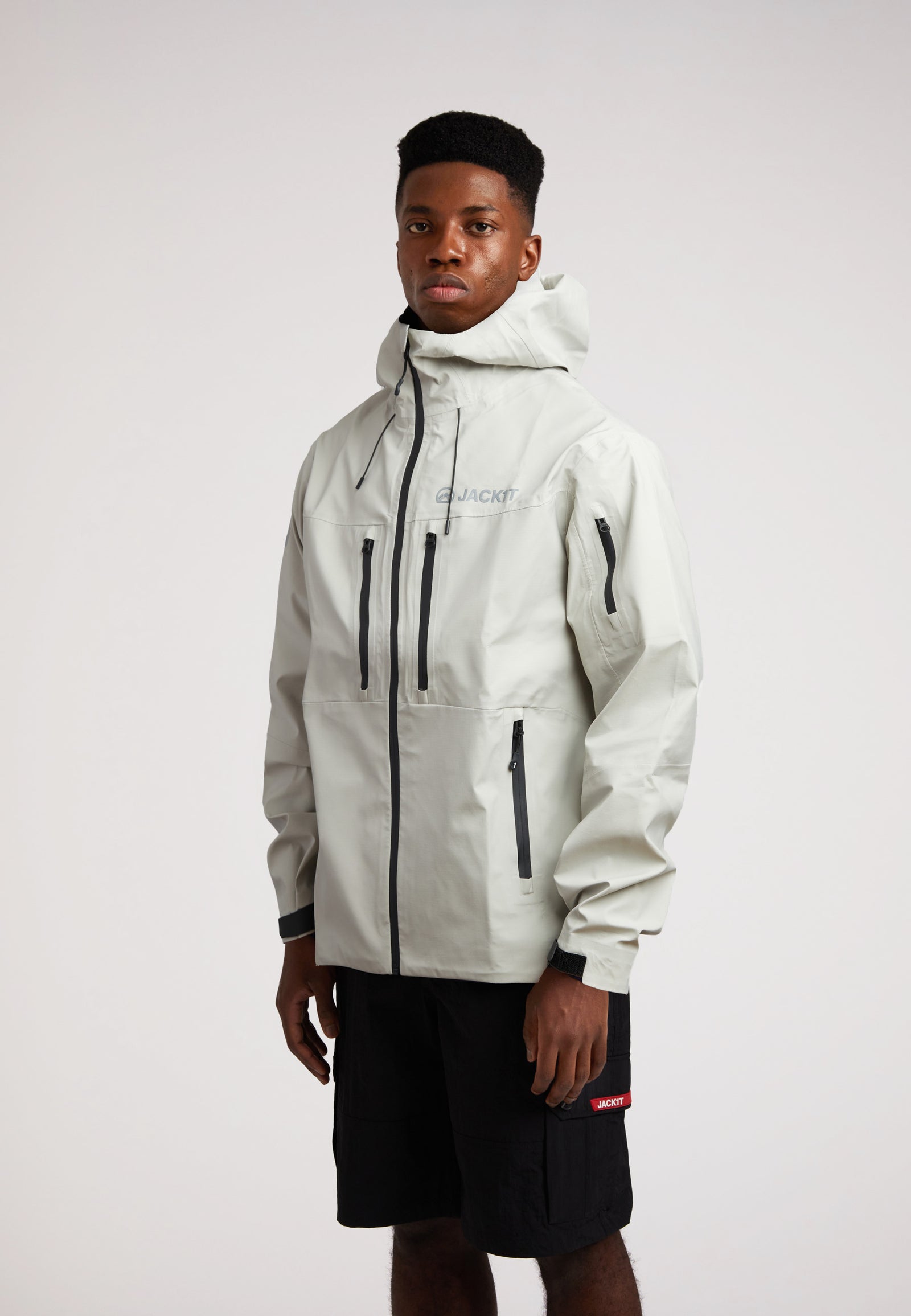 Stone mens lithium waterproof jacket worn by a model, showcasing its stylish design and functionality.