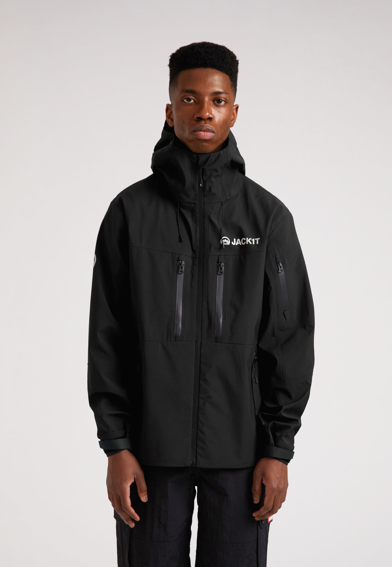 Black mens Lithium waterproof jacket worn by a model, showcasing its stylish and functional design.
