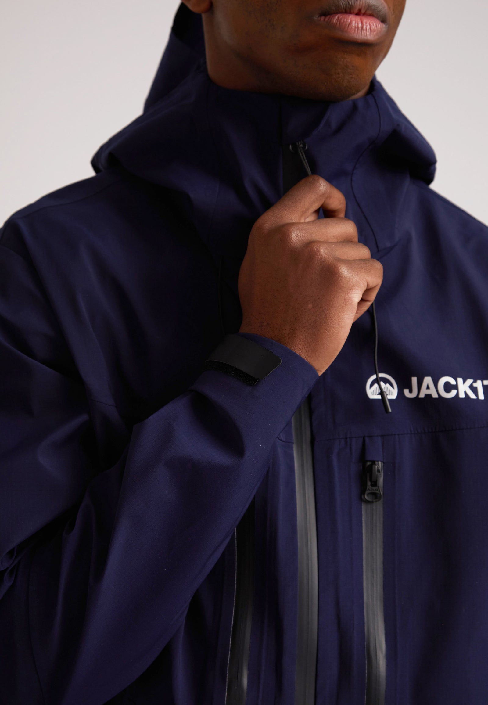 navy lithium waterproof mens jacket close-up showing durable fabric and design features for outdoor protection
