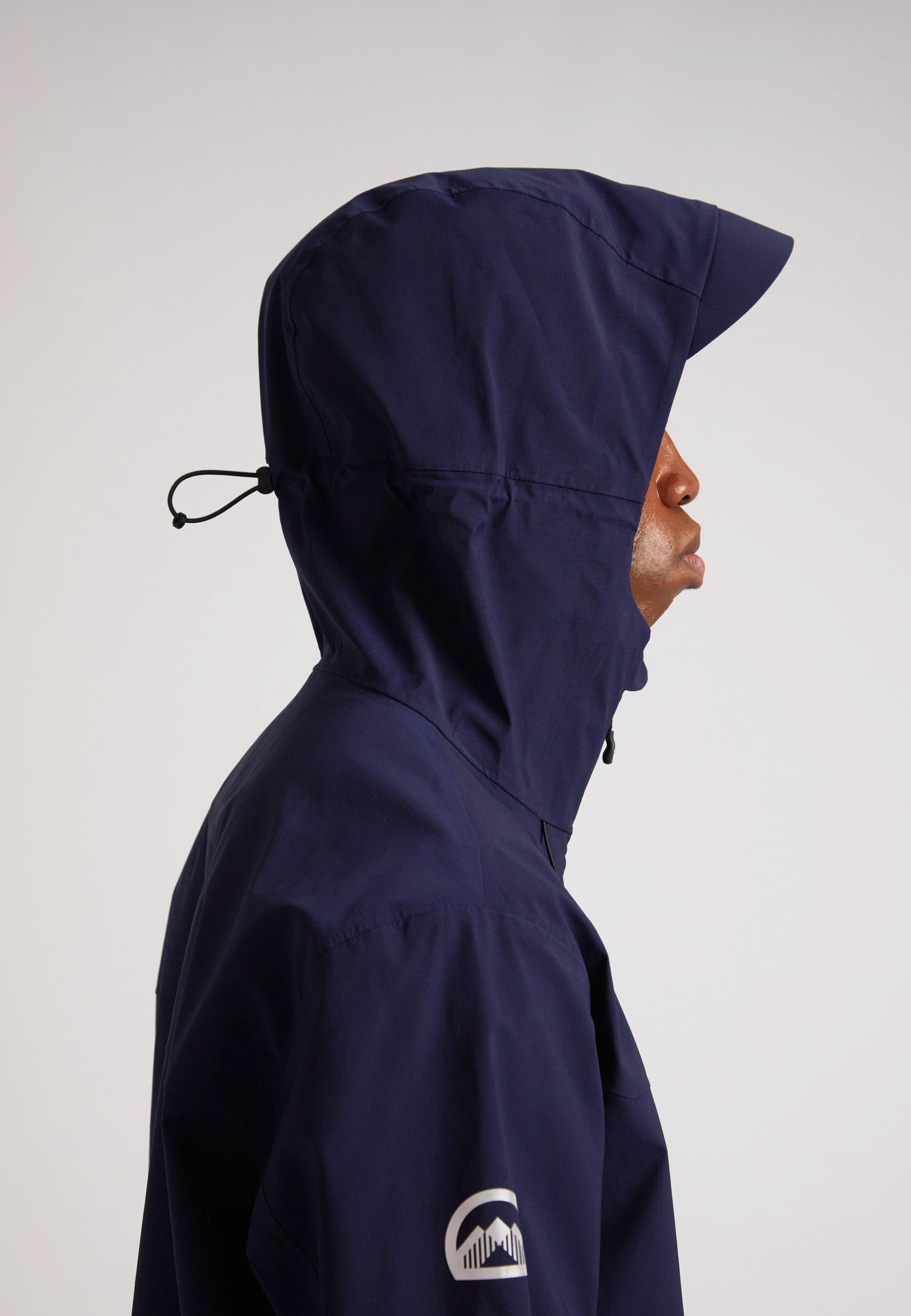 navy lithium waterproof mens jacket with adjustable hood shown from the side profile