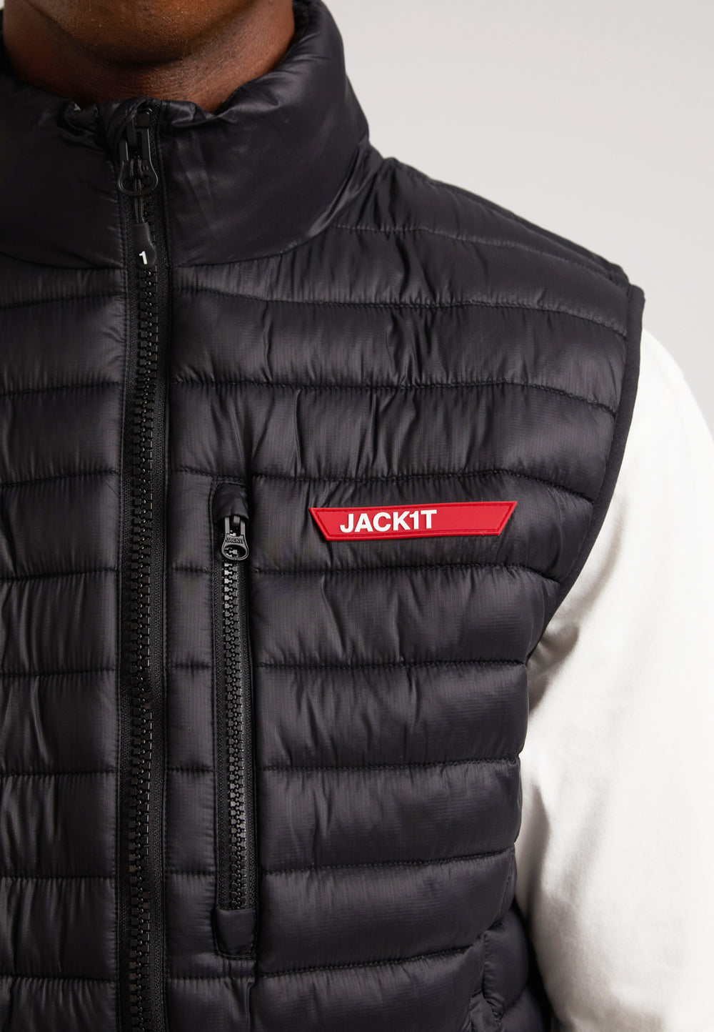 Close-up of the JACKIT Lightweight Puffer Gilet showcasing its ripstop fabric and stylish zippered pocket.