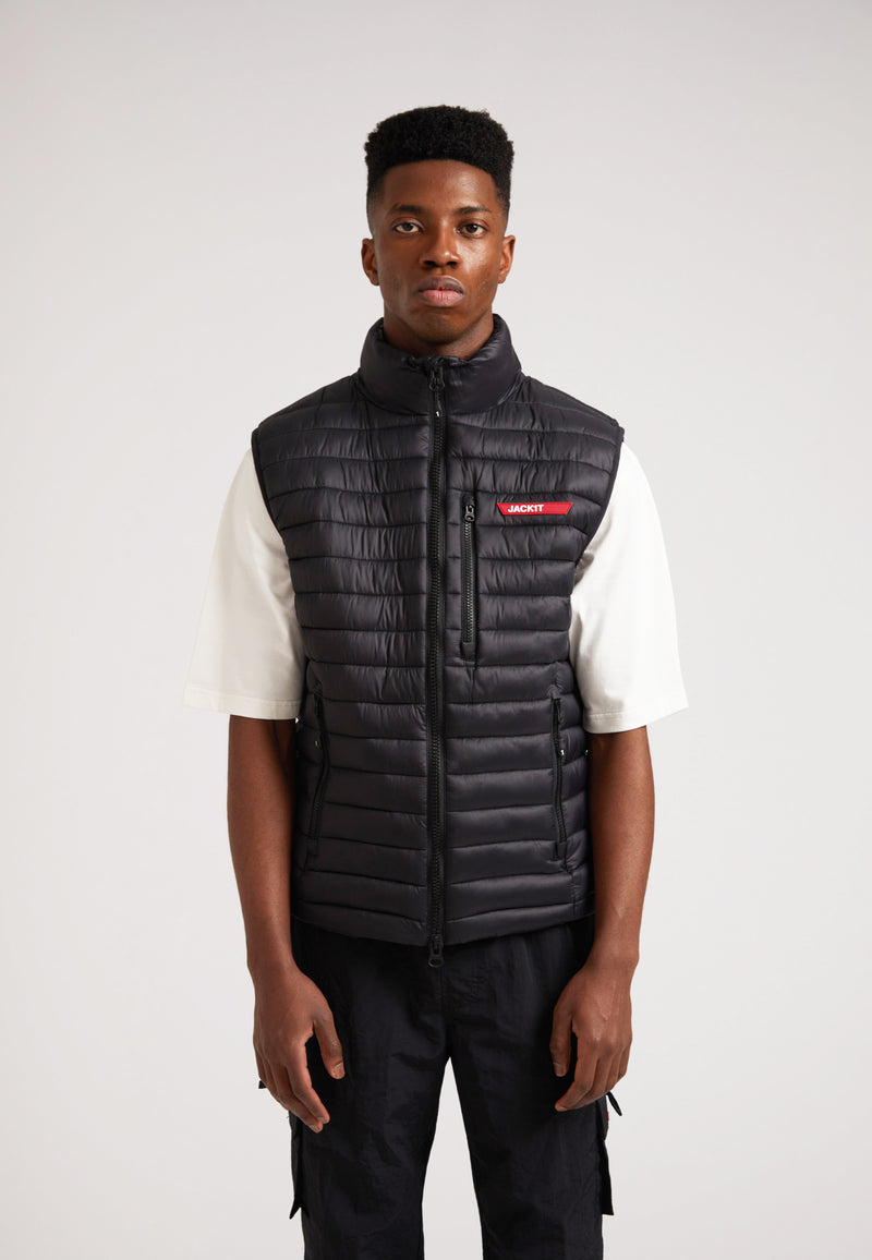 Model wearing SATEL1TE Lightweight Puffer Gilet 2.0 Black, showcasing sleek design and comfort.