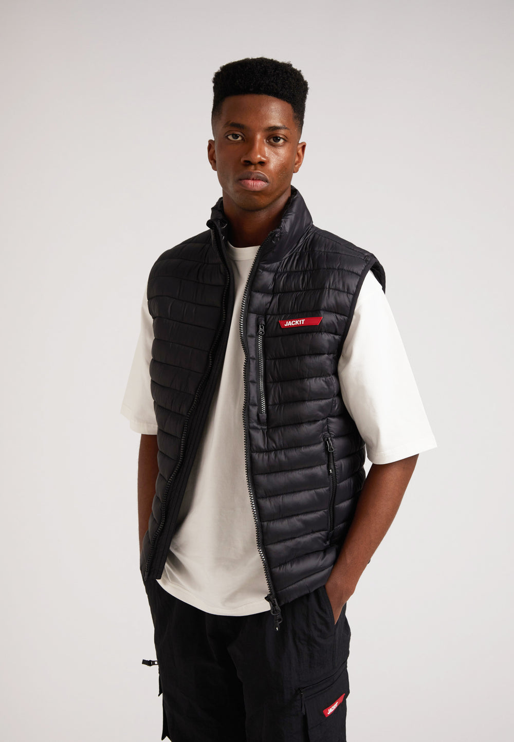 SATEL1TE Lightweight Puffer Gilet 2.0 Black worn by a model, featuring a stylish design and comfortable fit.