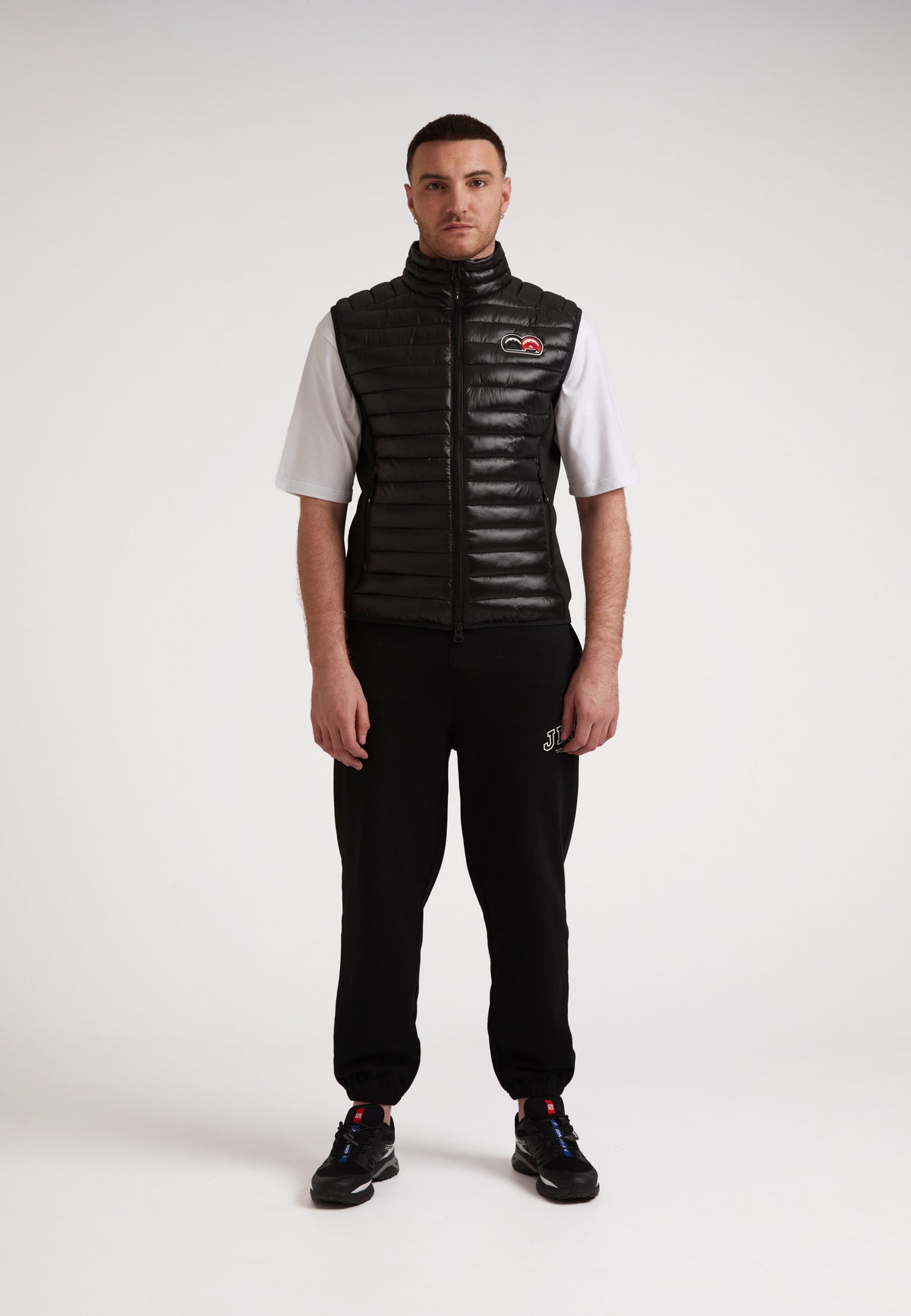 Model wearing SPORTL1TE Funnel Lightweight Gilet 2.0, showcasing a stylish lightweight gilet for outdoor activities.
