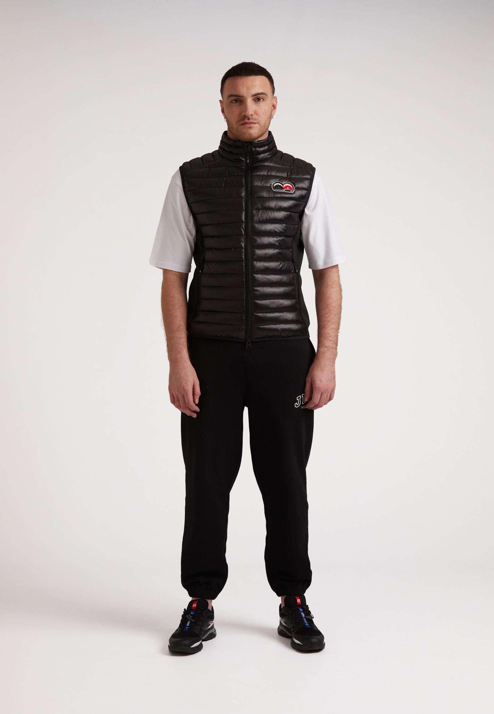 Model wearing SPORTL1TE Funnel Lightweight Gilet 2.0, showcasing a stylish lightweight gilet for outdoor activities.