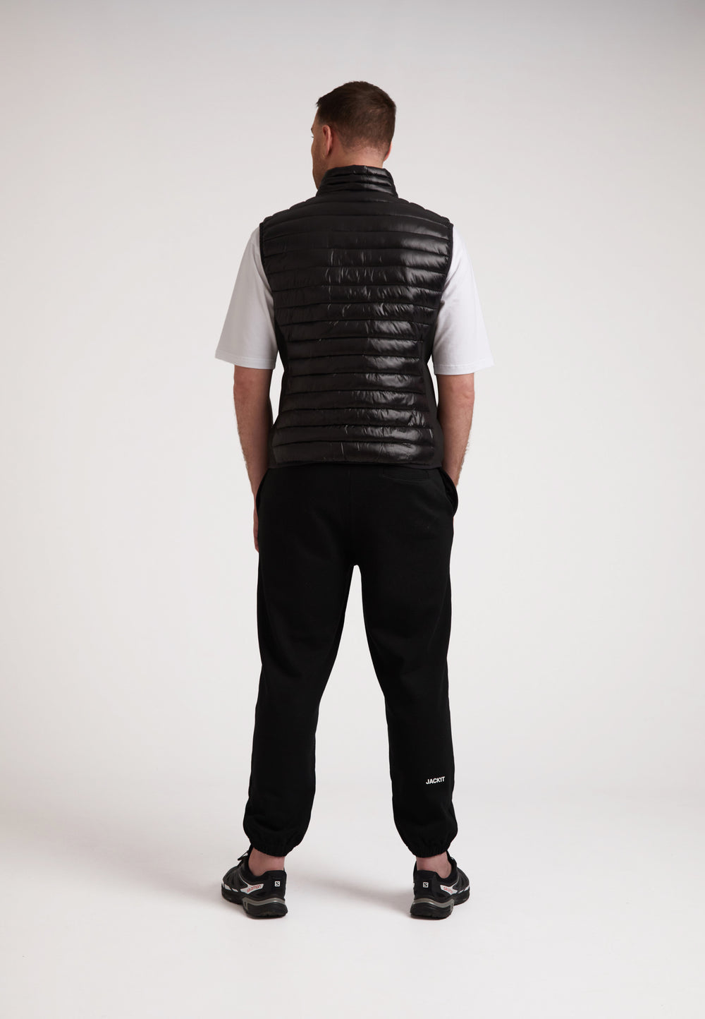 Back view of a model wearing the SPORTL1TE Funnel Lightweight Gilet 2.0, perfect lightweight gilet for outdoor activities.