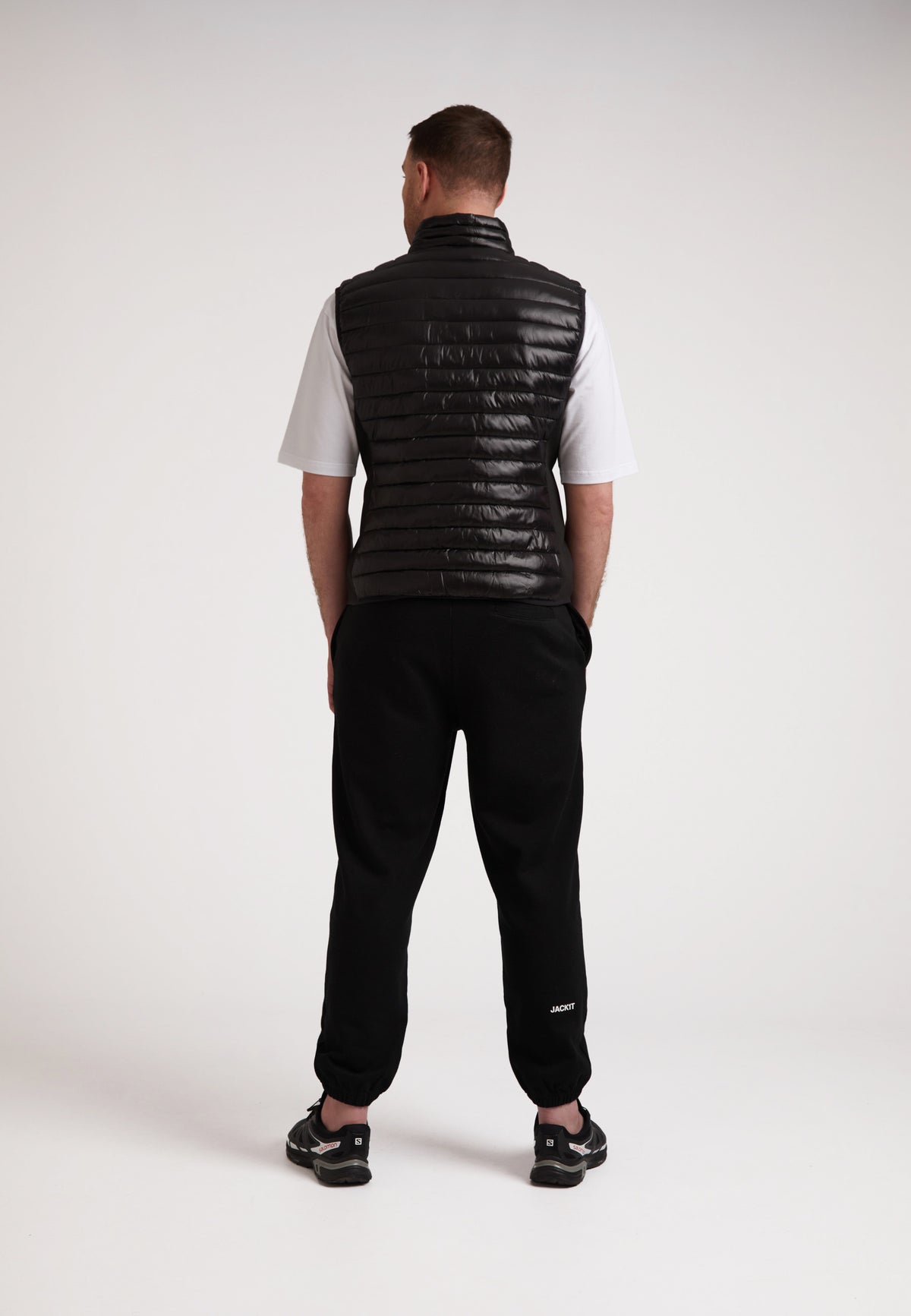 Back view of a model wearing the SPORTL1TE Funnel Lightweight Gilet 2.0, perfect lightweight gilet for outdoor activities.