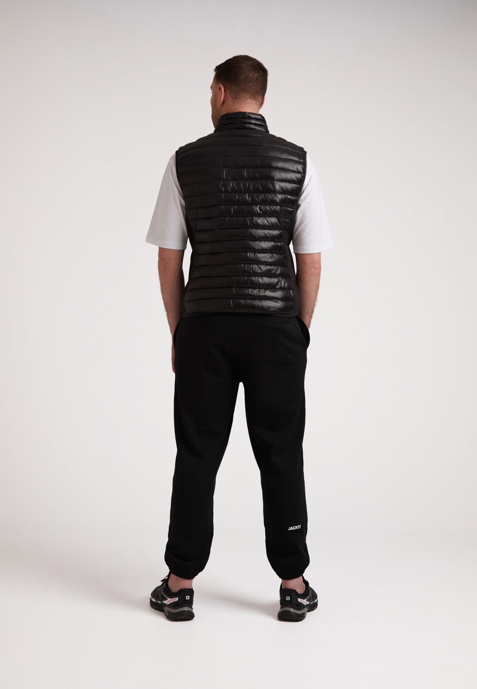 Back view of a model wearing the SPORTL1TE Funnel Lightweight Gilet 2.0, perfect lightweight gilet for outdoor activities.