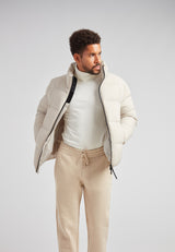 Cloud Lightweight Puffer Racer Jacket Stone worn by a model, showcasing its stylish design and functionality.