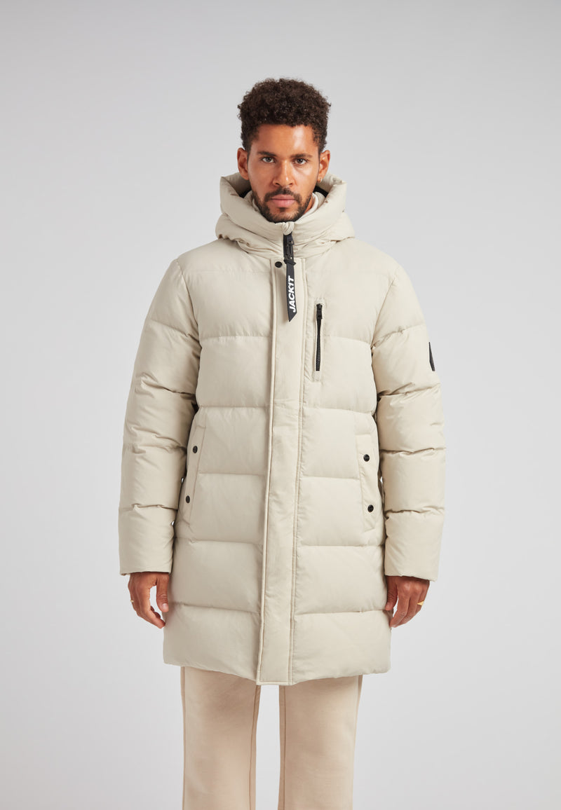 Stone Nomad Down Parka Coat for Men worn by a model in a light-colored setting.